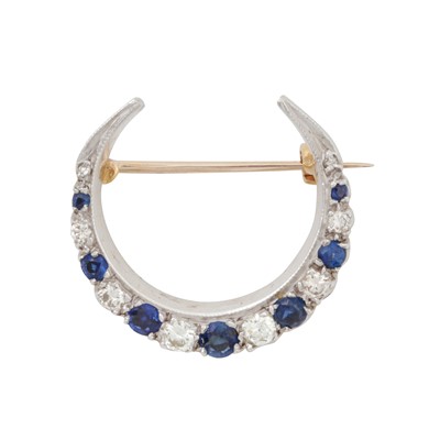 Lot 68 - A sapphire and diamond crescent brooch, circa 1976
