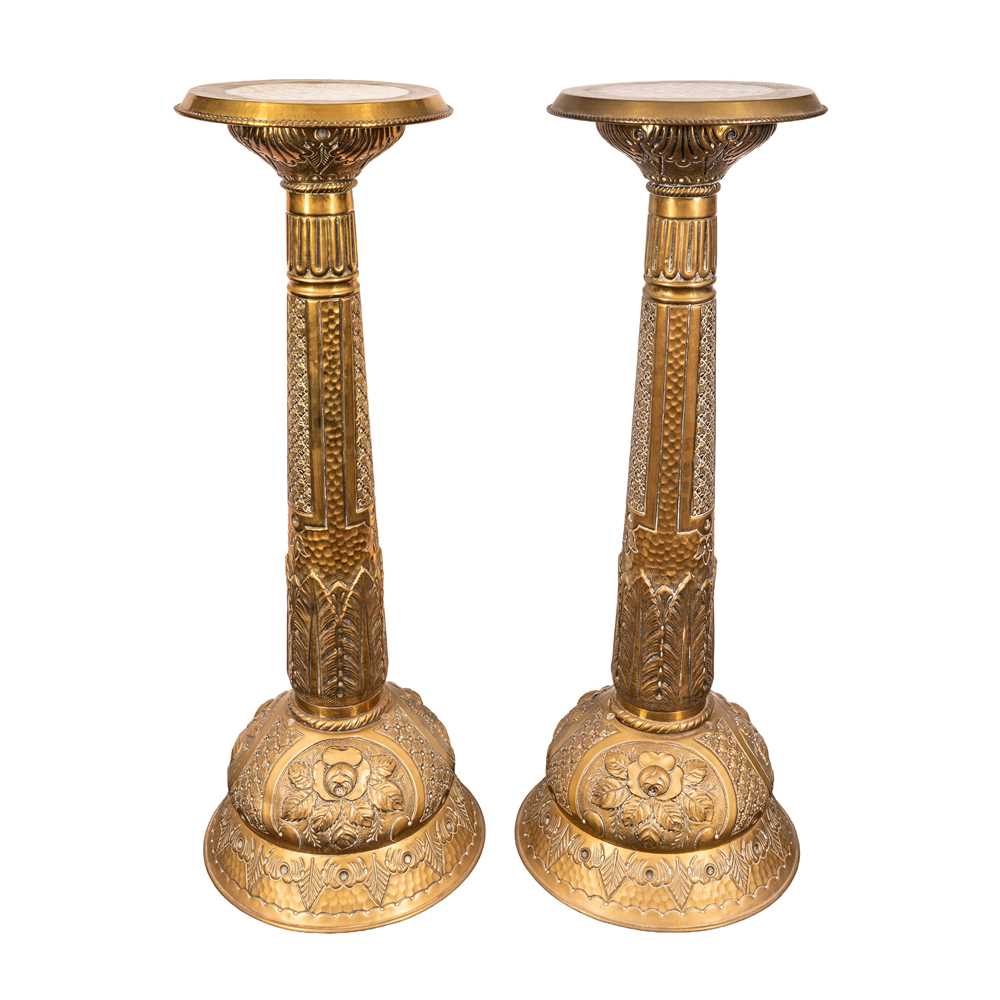 Lot 96 - A pair of brass jardiniere stands