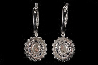 Lot 548 - A pair o 18ct white gold, sapphire and diamond...