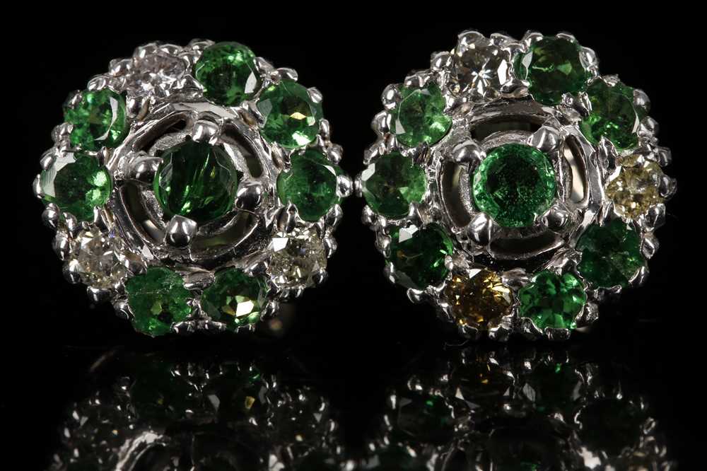 Lot 553 - A pair of high carat gold earrings, set with...