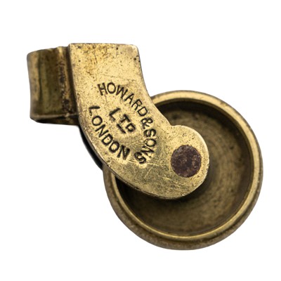 Lot 10 - A club armchair, attributed to Howard & Sons