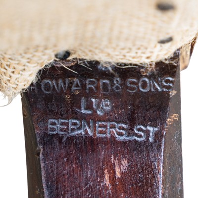 Lot 10 - A club armchair, attributed to Howard & Sons