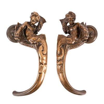Lot 95 - A pair of bronze doors handles, early 20th century