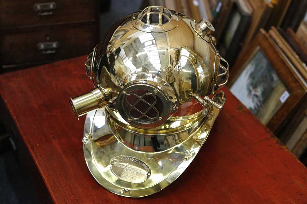 Lot 615 - A brass replica diving helmet, life size, 40cm...