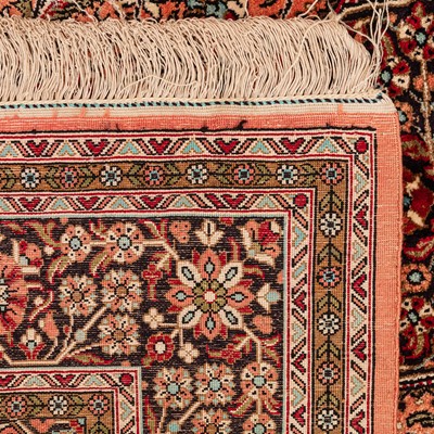 Lot 17 - An extremely fine silk Qum rug, central Persia
