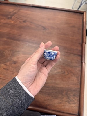 Lot 68 - Two Chinese blue and white 'dragon' cups, Qing dynasty, Guangxu period