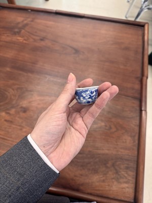 Lot 68 - Two Chinese blue and white 'dragon' cups, Qing dynasty, Guangxu period