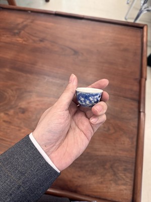 Lot 68 - Two Chinese blue and white 'dragon' cups, Qing dynasty, Guangxu period