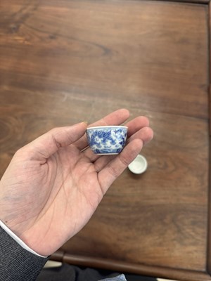 Lot 68 - Two Chinese blue and white 'dragon' cups, Qing dynasty, Guangxu period