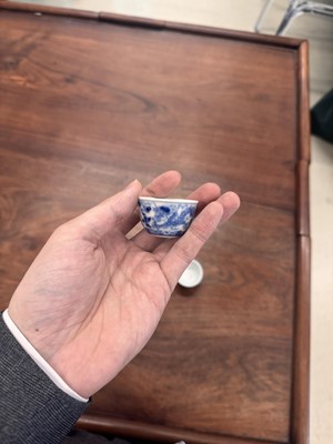 Lot 68 - Two Chinese blue and white 'dragon' cups, Qing dynasty, Guangxu period