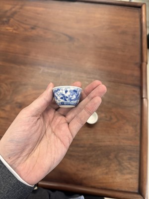 Lot 68 - Two Chinese blue and white 'dragon' cups, Qing dynasty, Guangxu period