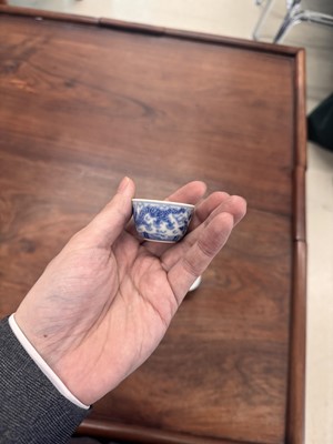 Lot 68 - Two Chinese blue and white 'dragon' cups, Qing dynasty, Guangxu period