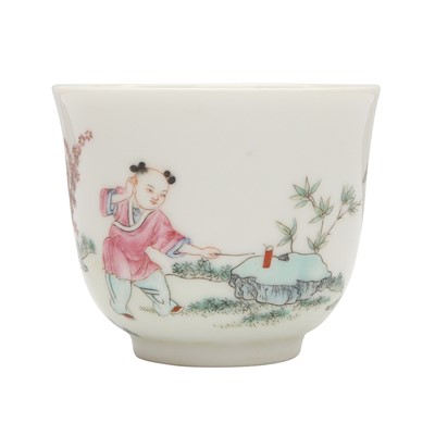 Lot 774 - A Chinese famile-rose 'boy and magpies' cup, 20th century, Daoguang mark