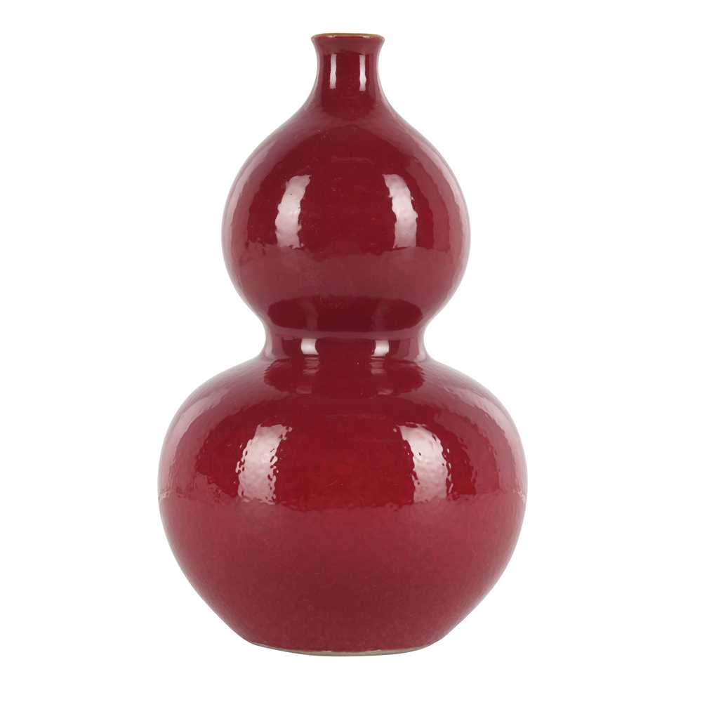 Lot 82 - A Chinese ruby-ground double-gourd vase, Qing dynasty, 19th century, Qianlong mark