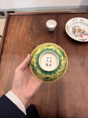 Lot 59 - A Chinese yellow-ground green-enamelled 'dragon' bowl, Qing dynasty, Tongzhi mark and of the period