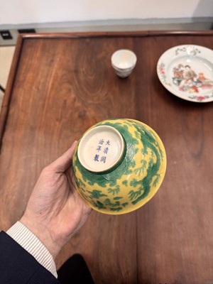 Lot 59 - A Chinese yellow-ground green-enamelled 'dragon' bowl, Qing dynasty, Tongzhi mark and of the period