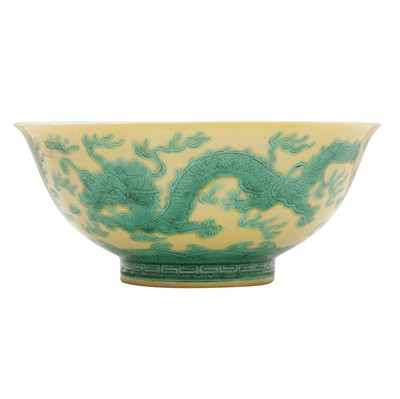 Lot 59 - A Chinese yellow-ground green-enamelled 'dragon' bowl, Qing dynasty, Tongzhi mark and of the period