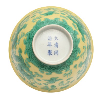 Lot 59 - A Chinese yellow-ground green-enamelled 'dragon' bowl, Qing dynasty, Tongzhi mark and of the period
