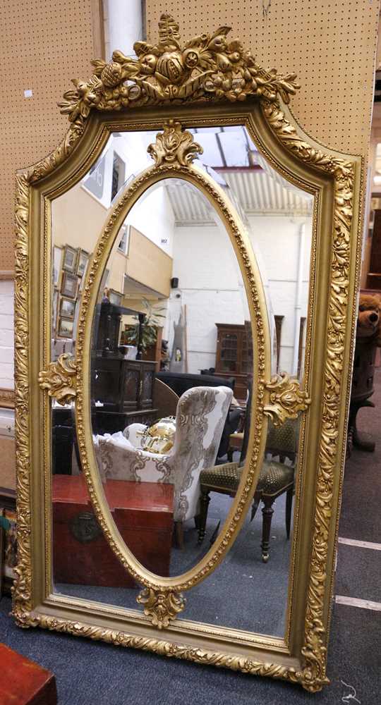 Lot 802 - A large gilt frame mirror, florally moulded...