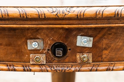 Lot 34 - A late Victorian figured walnut extending dining table by Maple & Co.