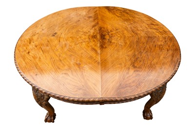 Lot 34 - A late Victorian figured walnut extending dining table by Maple & Co.