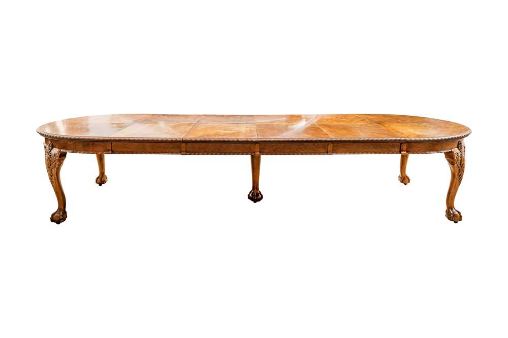 Lot 34 - A late Victorian figured walnut extending dining table by Maple & Co.