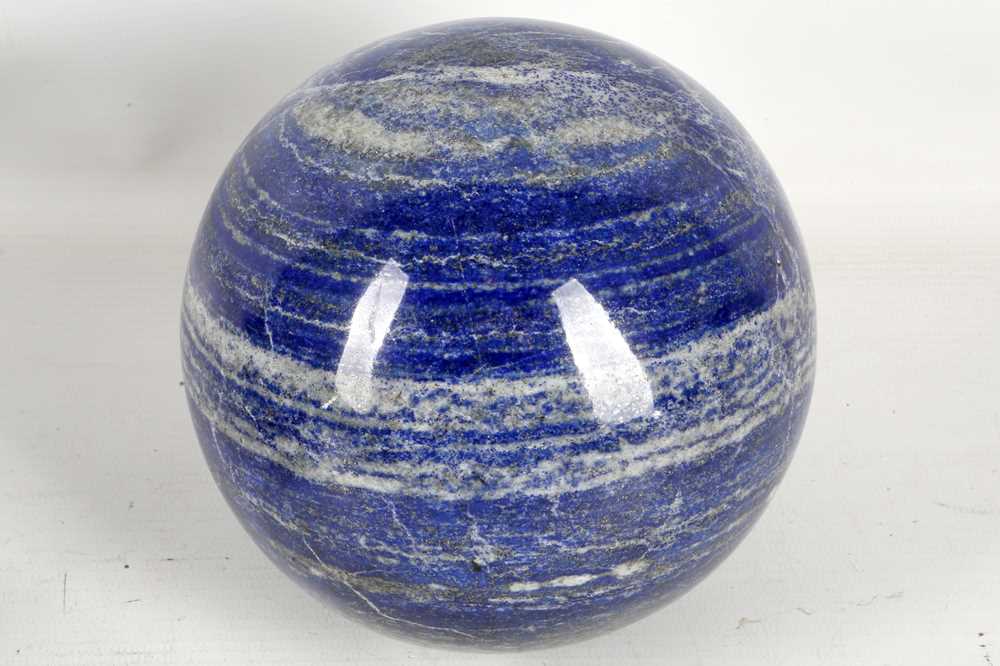 Lot 606 - A large polished lapis lazuli sphere, 13½cm.