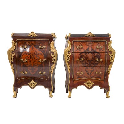 Lot 252 - A pair of French Louis XV style marquetry inlaid bombé commodes