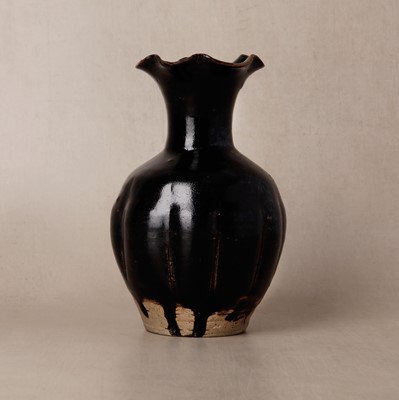 Lot 282 - A Chinese Henan black-glazed foliate vase, Song dynasty