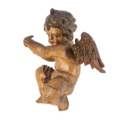 Lot 91 - A south German carved figure of a putto