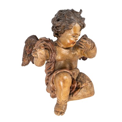 Lot 91 - A south German carved figure of a putto