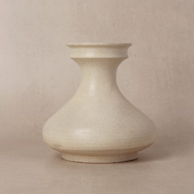 Lot 252 - A Chinese white-glazed pear-shaped jar, Tang dynasty