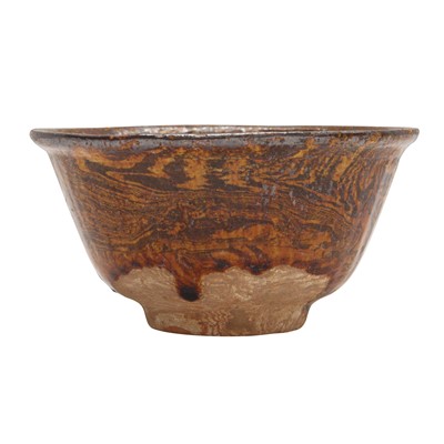 Lot 253 - A Chinese amber-glazed marbled pottery cup, Tang dynasty
