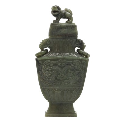 Lot 321 - A Chinese spinach jade twin-handled vase and cover, Qing dynasty, 19th century