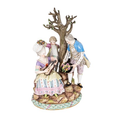 Lot 182 - A Meissen porcelain figural group depicting a pair of lovers and a child beneath a tree