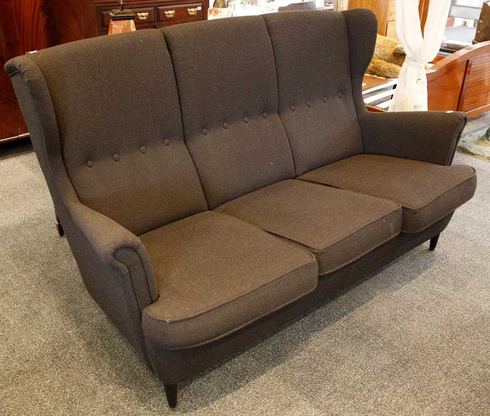 Lot 876 - A contemporary high wing back sofa, black...