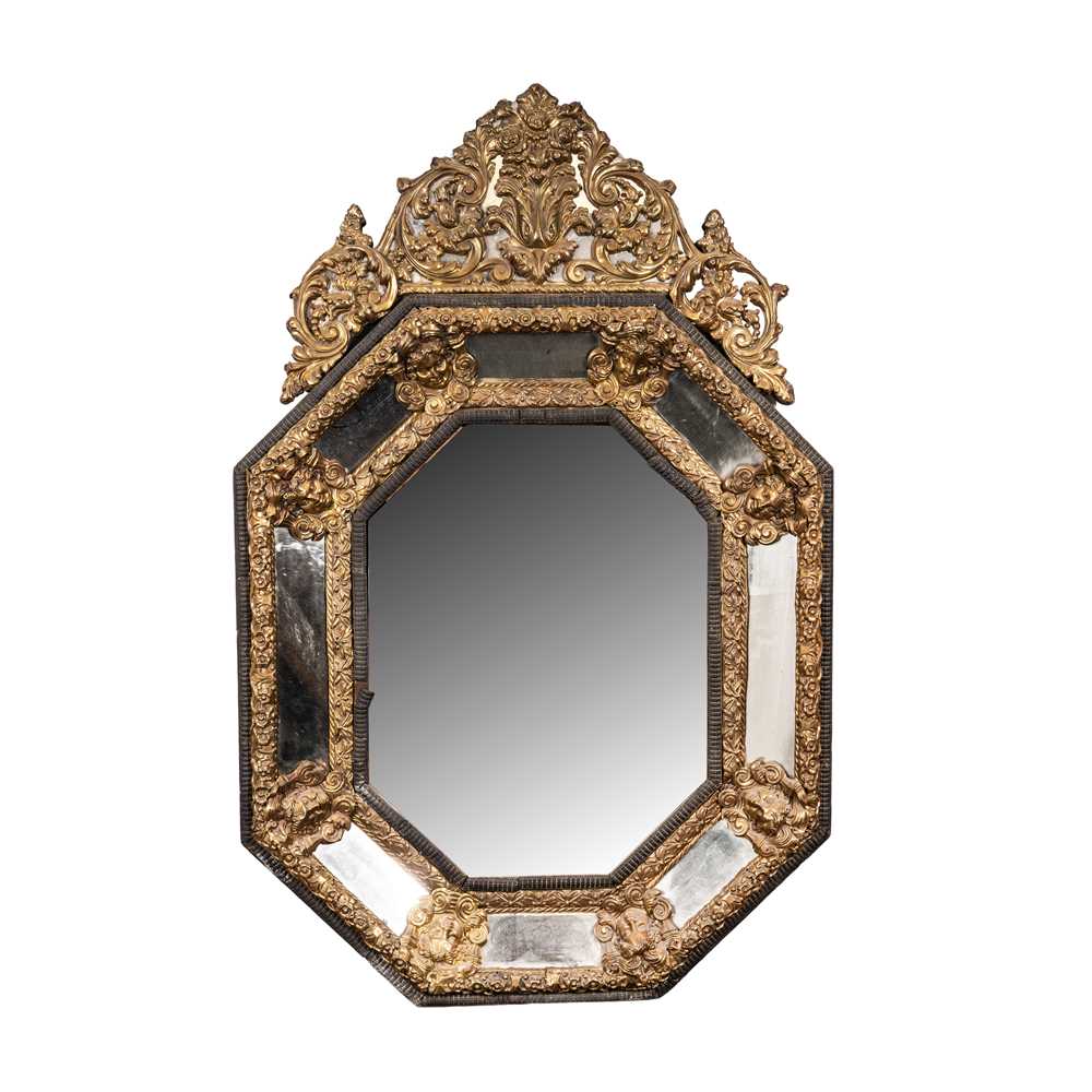 Lot 55 - A Dutch Baroque style repousse brass mirror, 19th century