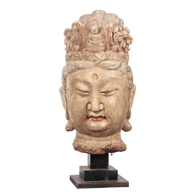 Lot 214 - A very large Chinese painted stucco head of Guanyin, Qing dynasty, 18th century