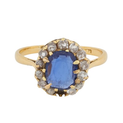 Lot 42 - A sapphire and diamond halo ring