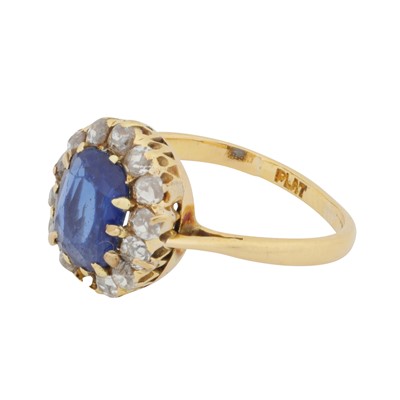 Lot 42 - A sapphire and diamond halo ring