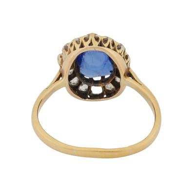 Lot 42 - A sapphire and diamond halo ring