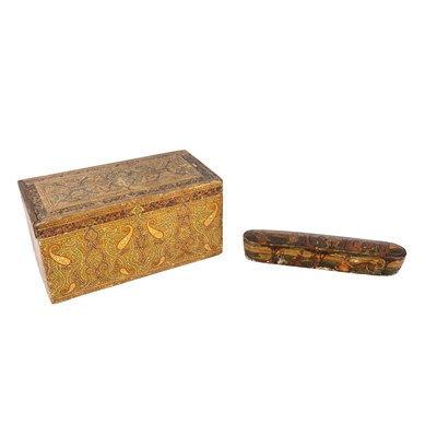 Lot 140 - A Persian Qajar lacquered rectangular tea caddy