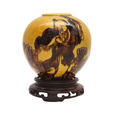Lot 360 - A Chinese yellow and brown glazed 'Daoist Immortal' waterpot, 19th century
