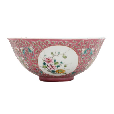 Lot 626 - A Chinese ruby-ground famille-rose 'floral medallion' bowl, Qing dynasty, Guangxu period