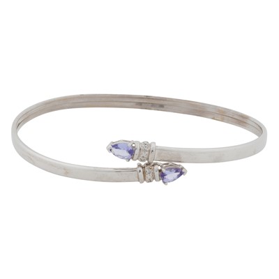 Lot 78 - A tanzanite and diamond spring bangle