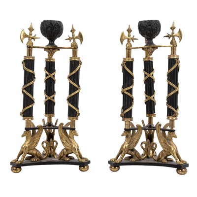 Lot 296 - A pair of Louis Phillipe patinated and gilt bronze candlesticks