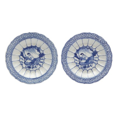Lot 303 - A pair of Chinese blue and white 'acupuncturist' saucer dishes, Qing dynasty, Kangxi period