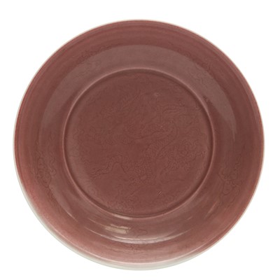 Lot 336 - A Chinese copper-red incised 'dragon' dish, 20th century, Xuande mark