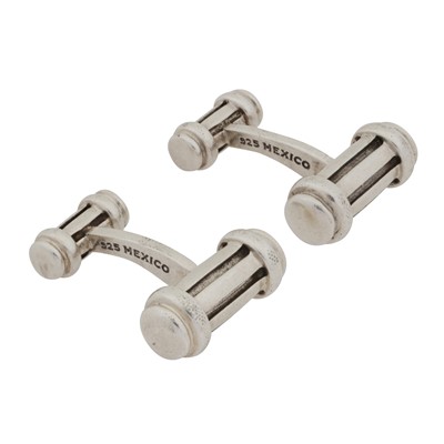 Lot 114 - Tiffany & Co. | A pair of barrel shaped silver cufflinks