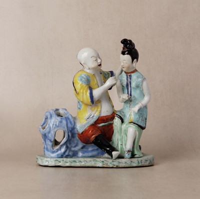 Lot 140 - A fine Chinese export famille-rose figure of a seated man and lady, Qing dynasty, Qianlong period